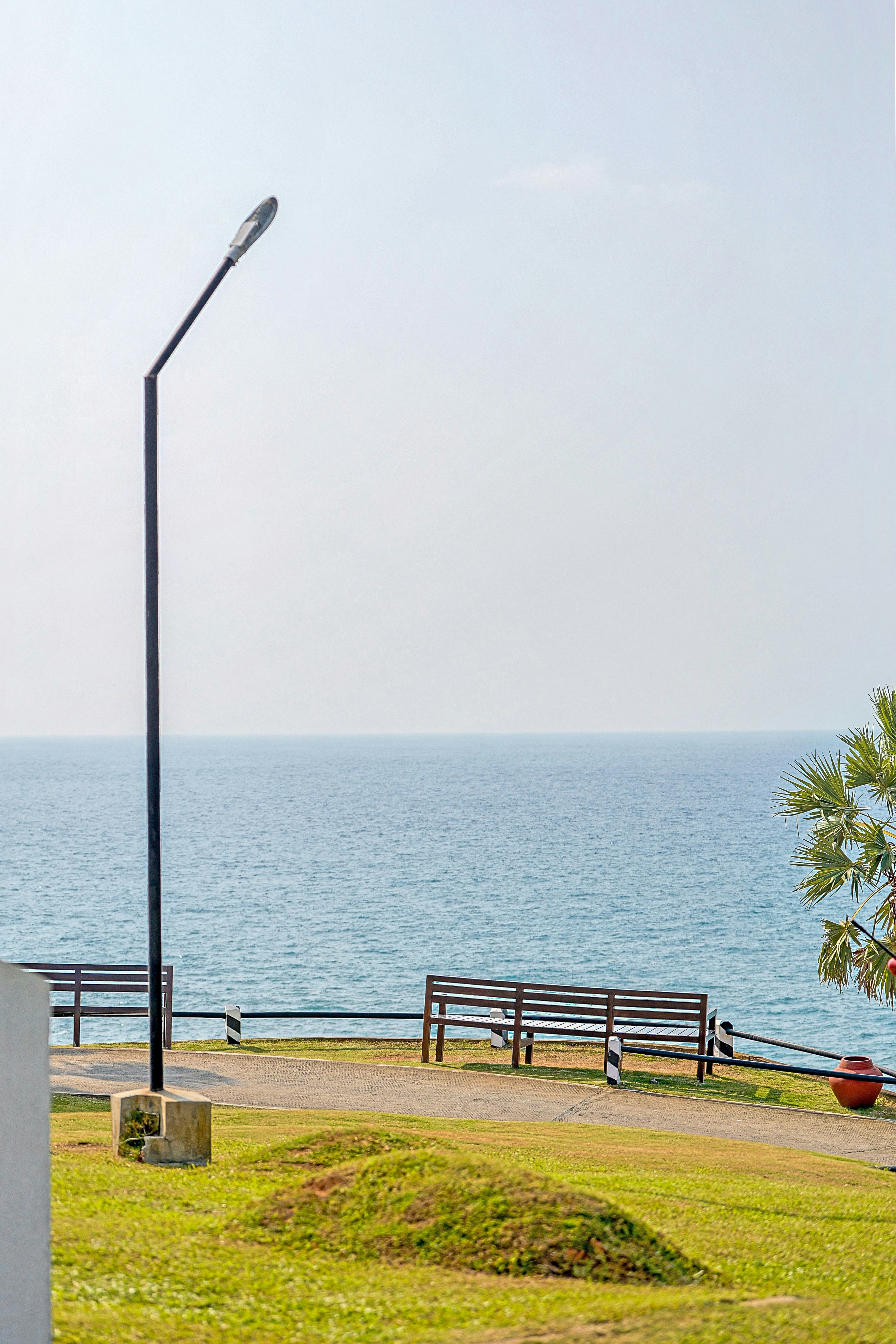 A view of the ocean from the top of a hill