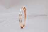 A close up of a bracelet on a white surface