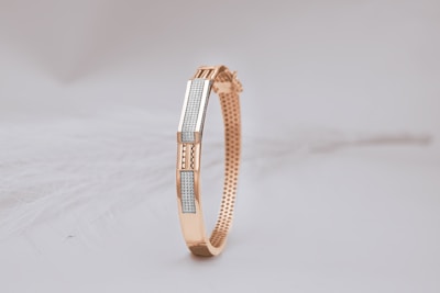A close up of a bracelet on a white surface