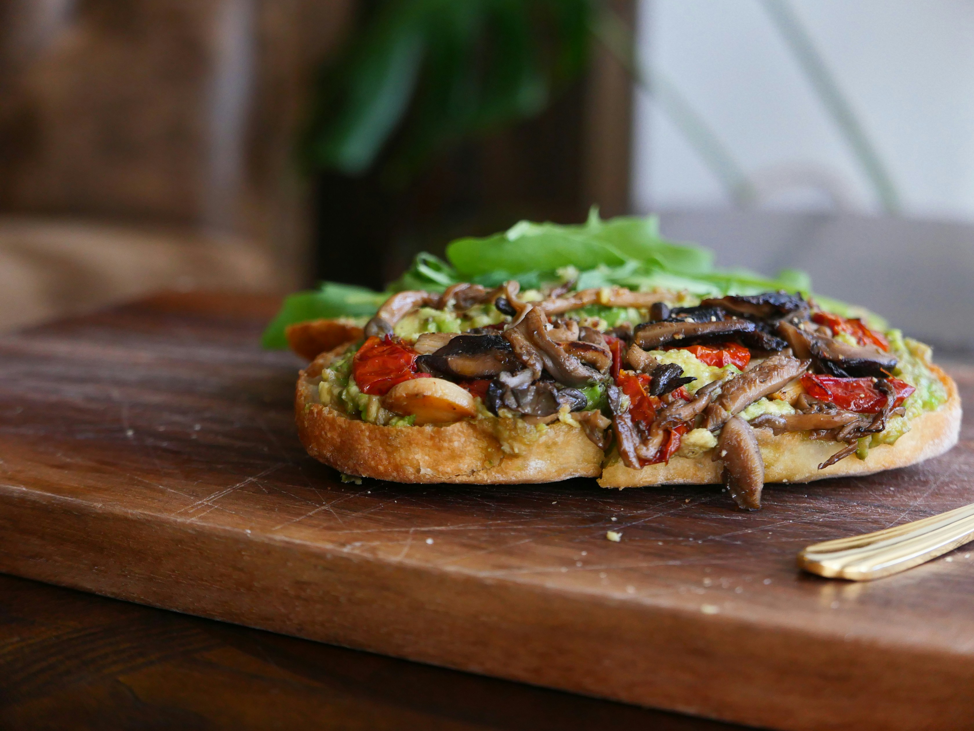 A close up of a sandwich on a cutting board