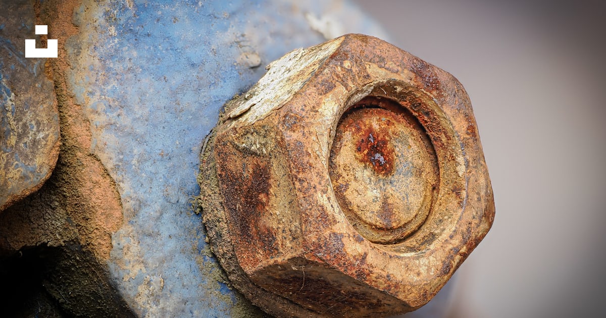 A rusted metal object with a hole in the middle photo – Free Rust Image ...