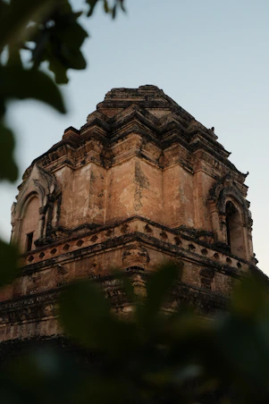 A tall tower with a clock on top of it