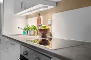 A kitchen with a stove and a sink