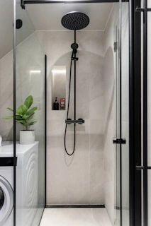 A washer and dryer in a small bathroom