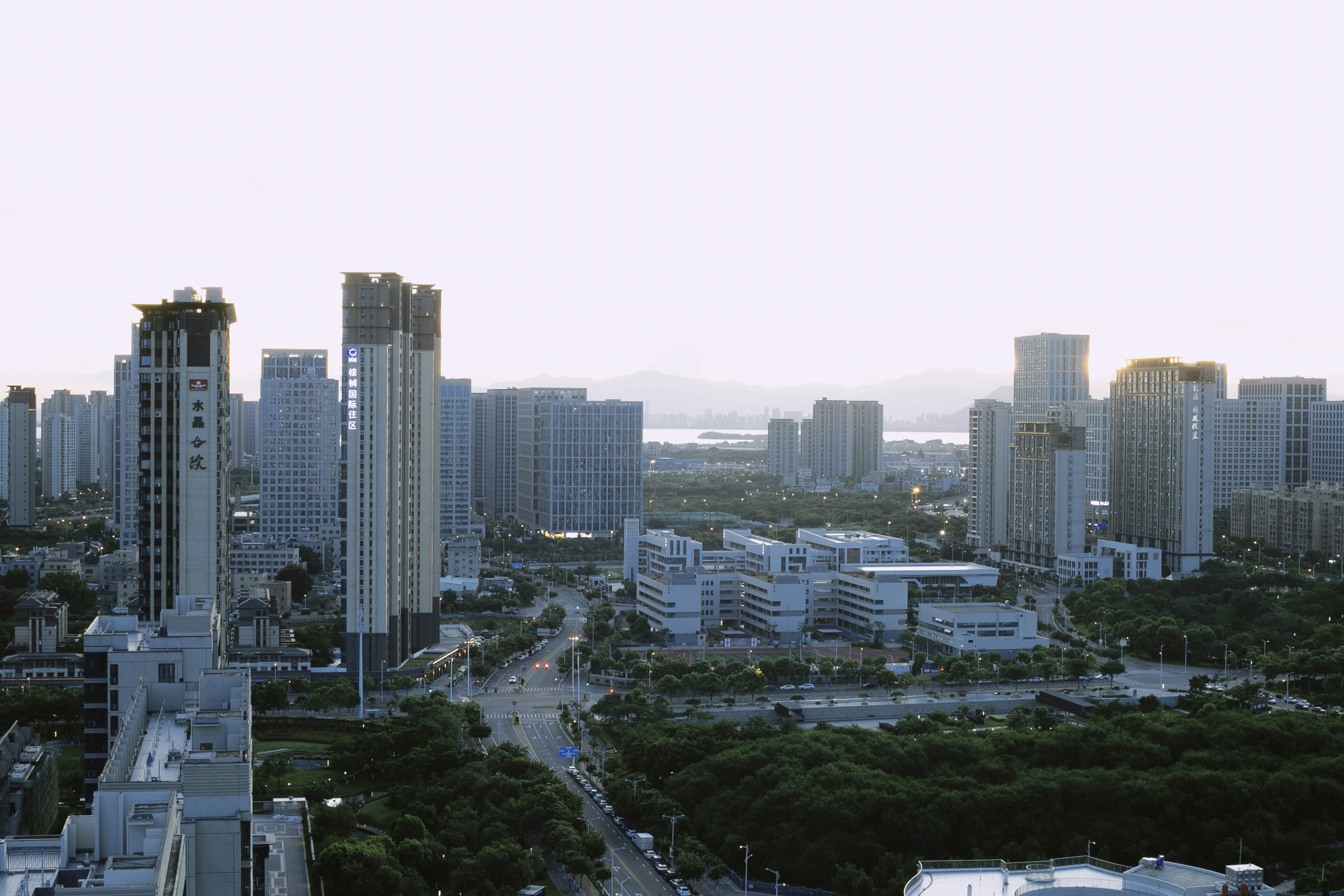 An aerial view of a city with tall buildings