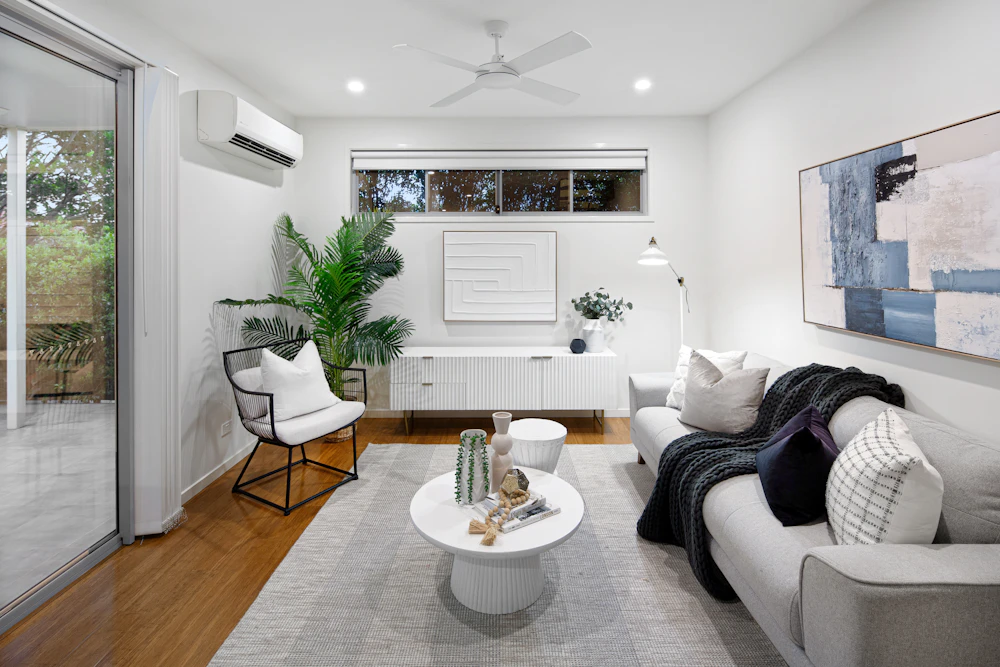 Living room with ceiling fan and air conditioning