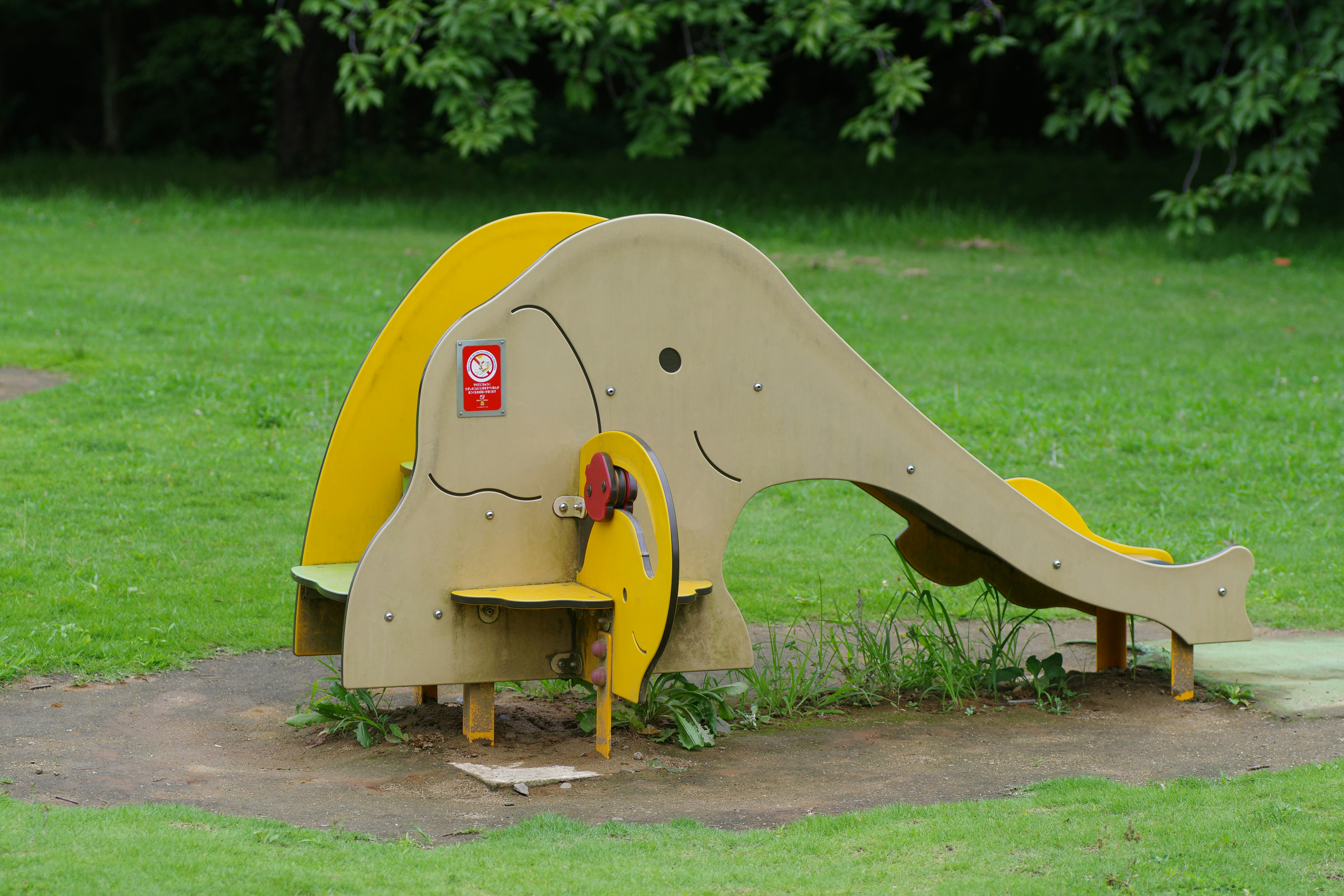 Elephant-shaped play structure on grass
