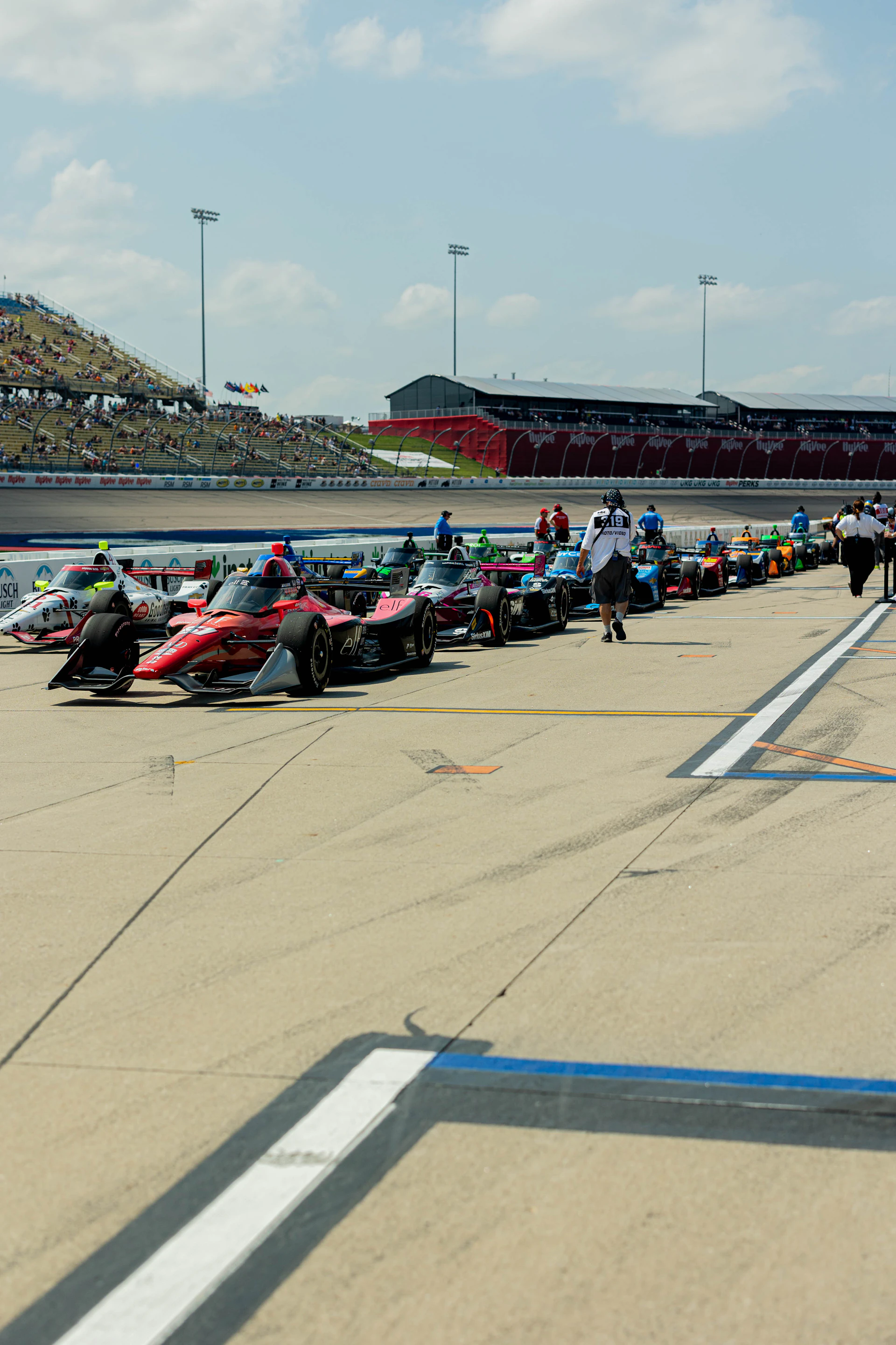 IndyCars lined up on the grid