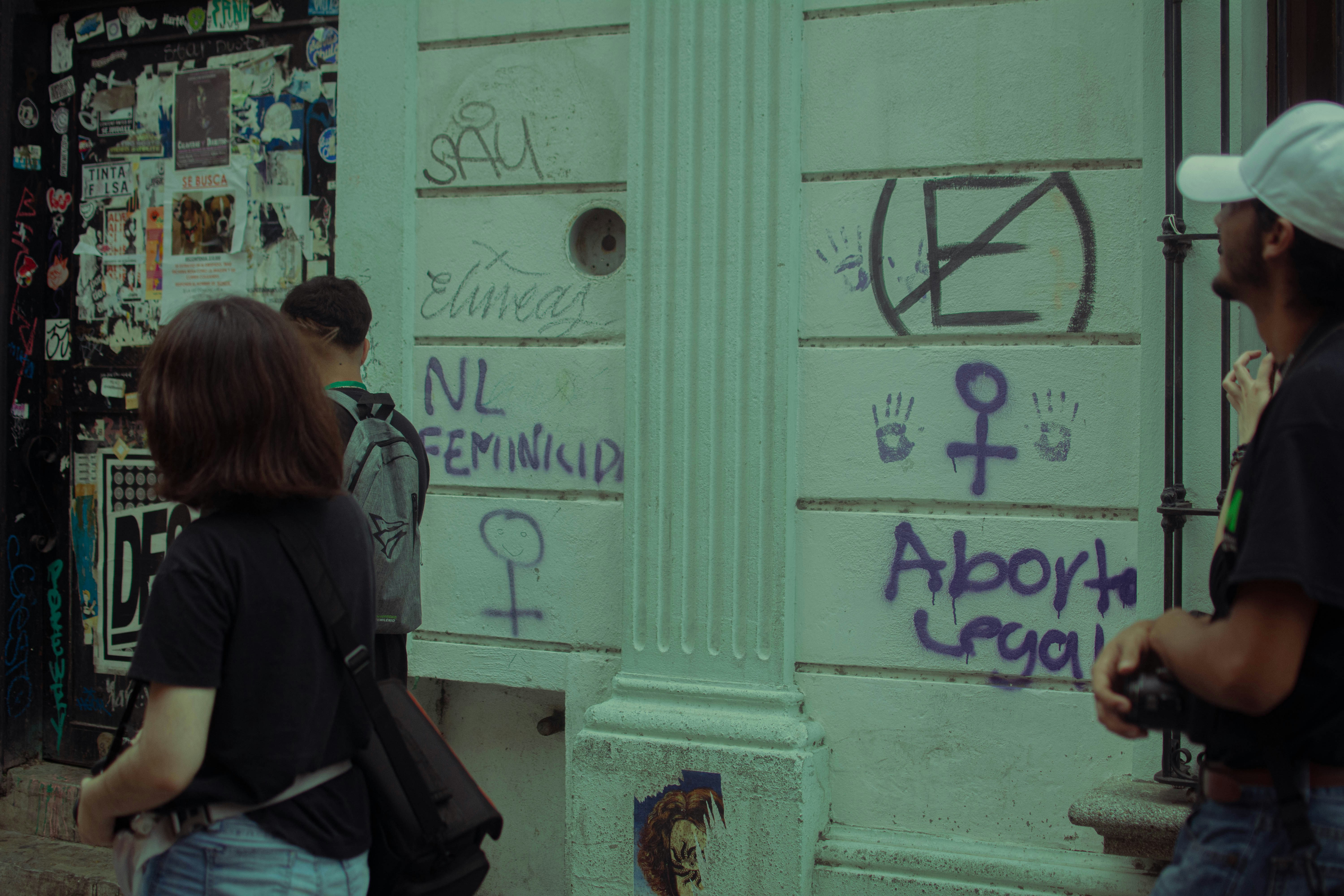 A group of people standing outside of a building