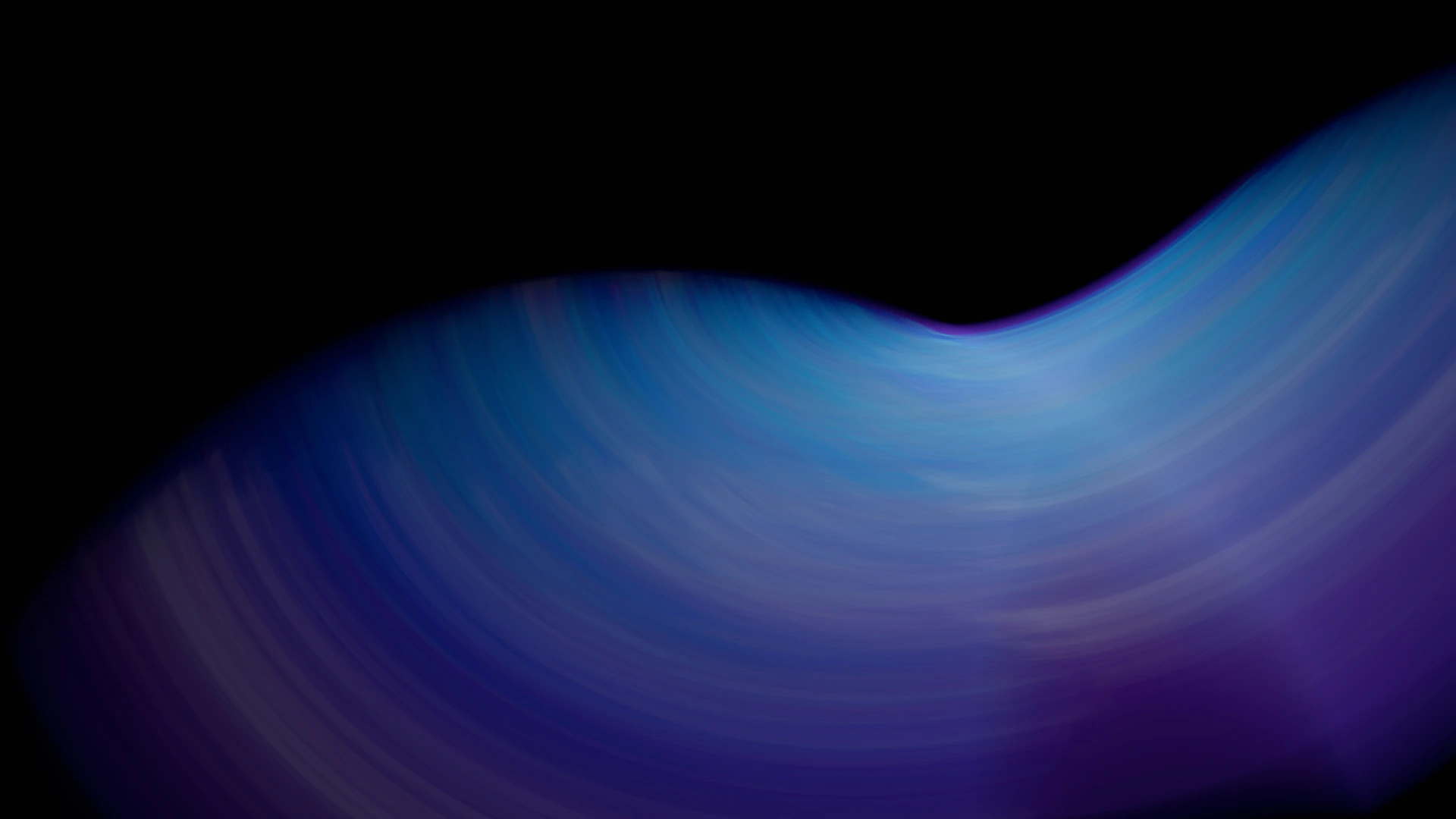 A blurry image of a blue and purple wave