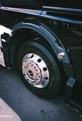 A close up of a black truck tire