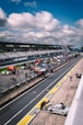 A race track with cars lined up on the side of it