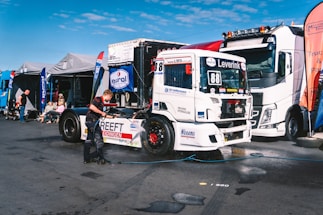 A group of semi trucks parked next to each other