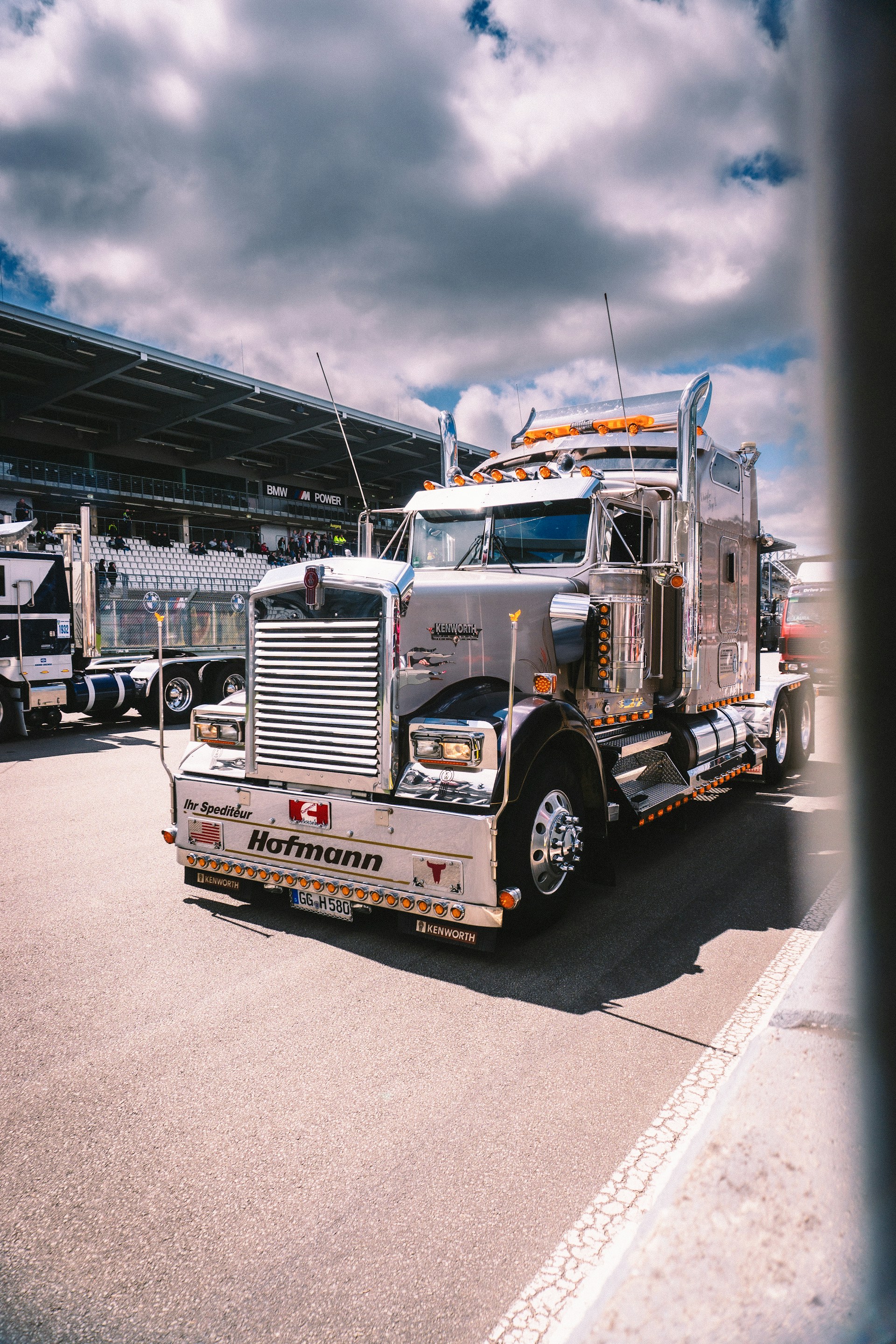 A large semi truck driving down a street