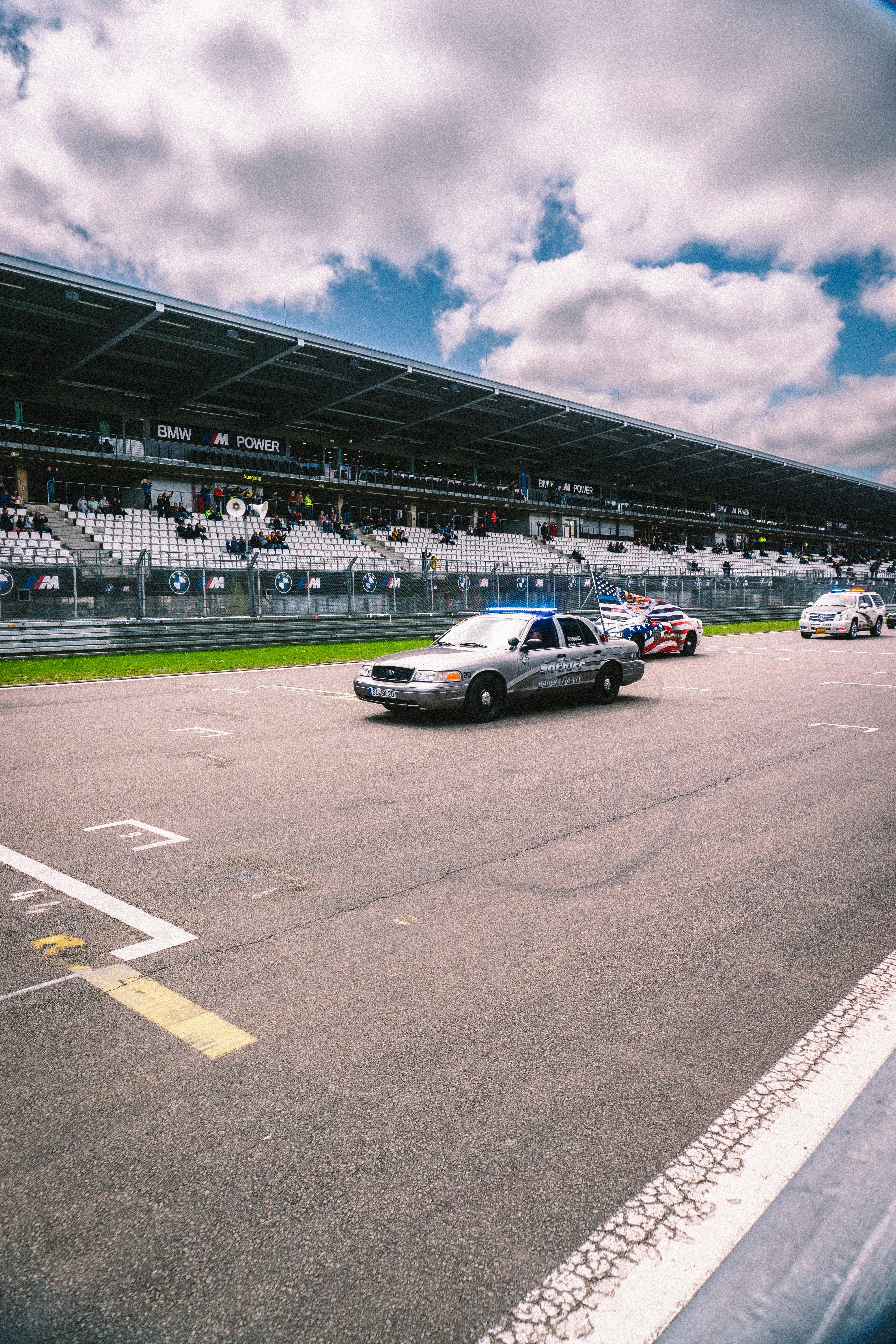 A police car driving down a race track photo – Free Car Image on Unsplash