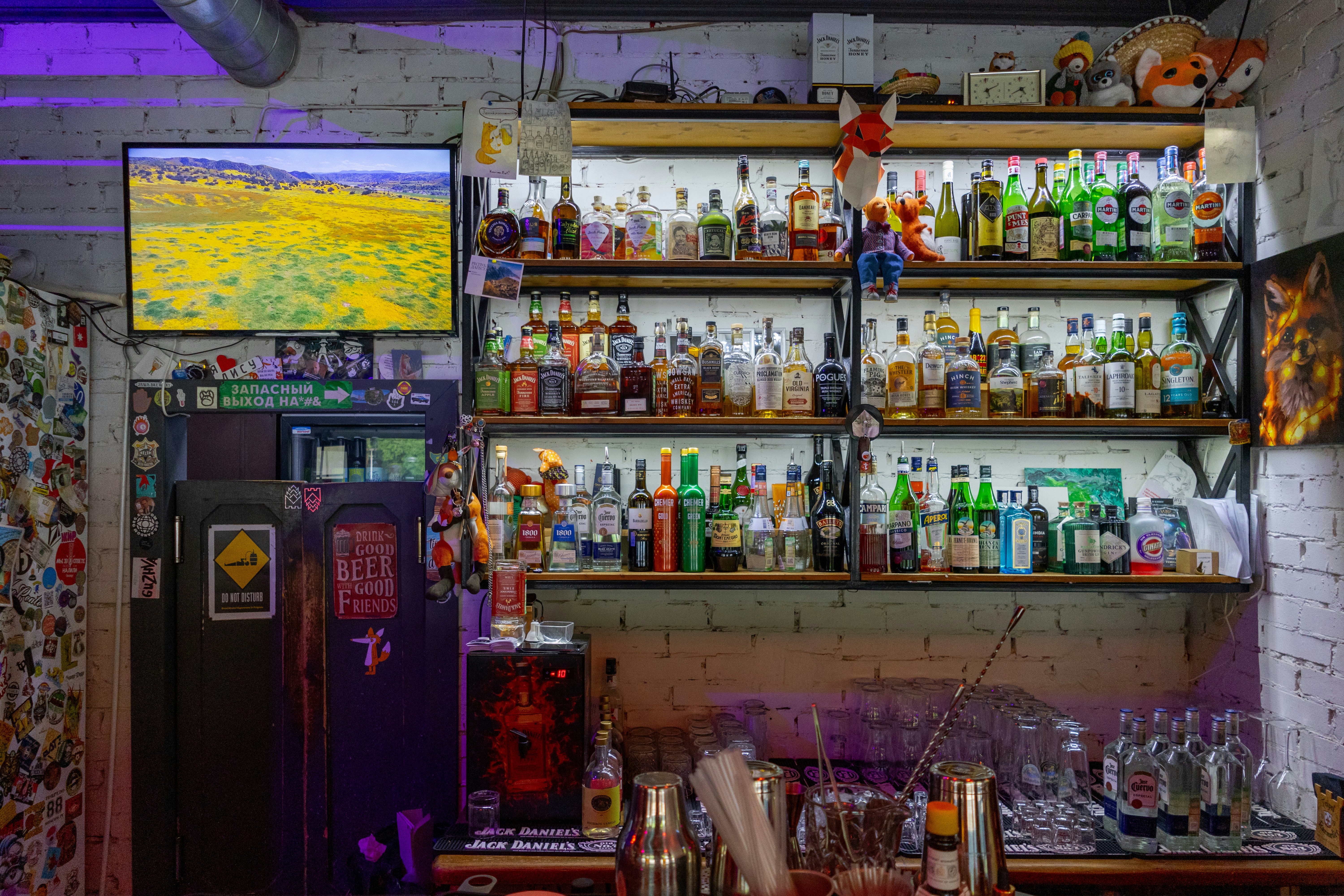 A room filled with lots of bottles and glasses