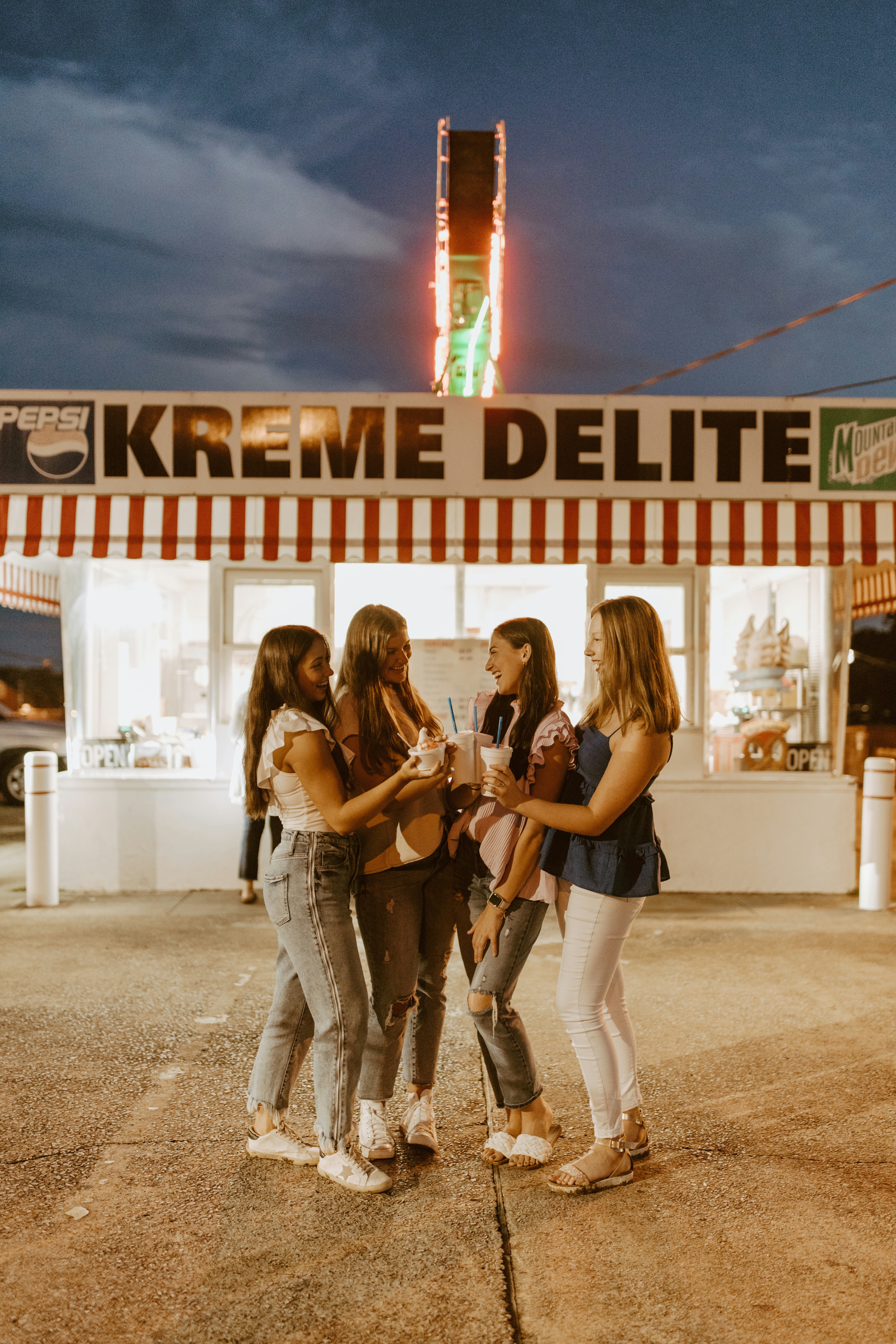 A group of women standing in front of a store