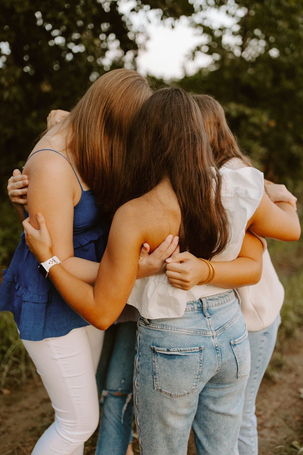 Women embracing together