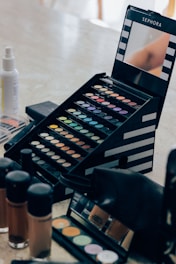 A table with makeup and cosmetics on it