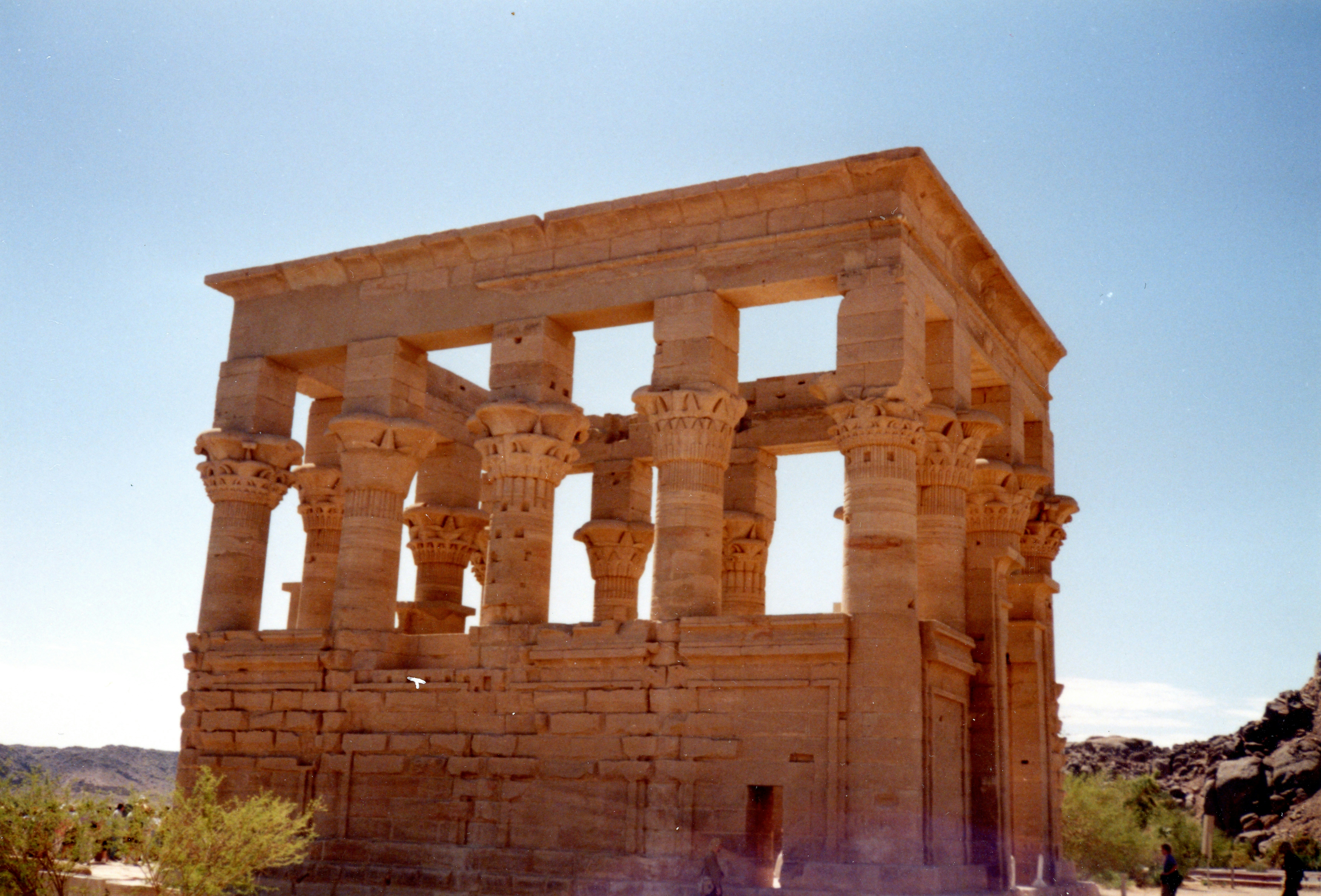 A large stone structure sitting in the middle of a desert