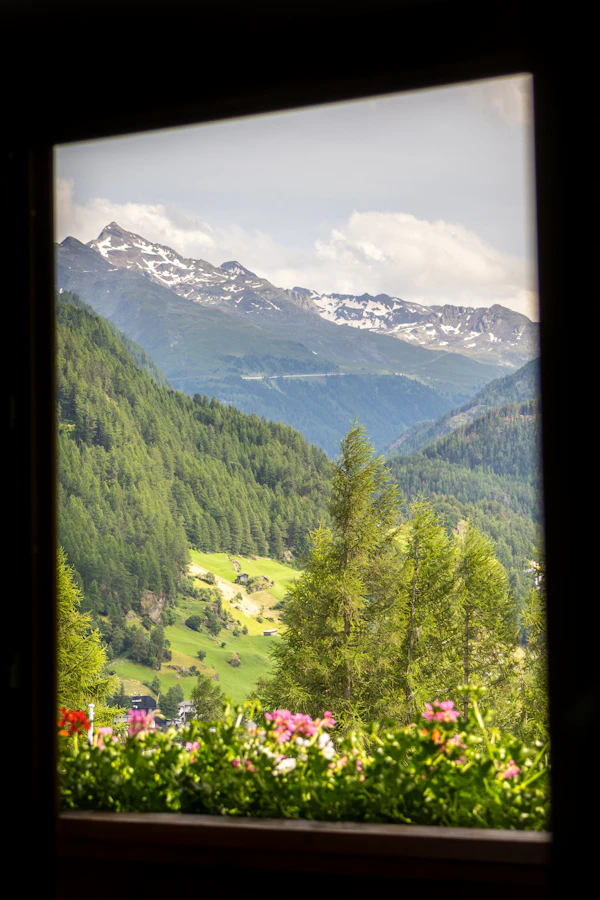 Window with a view of a valley and mountains