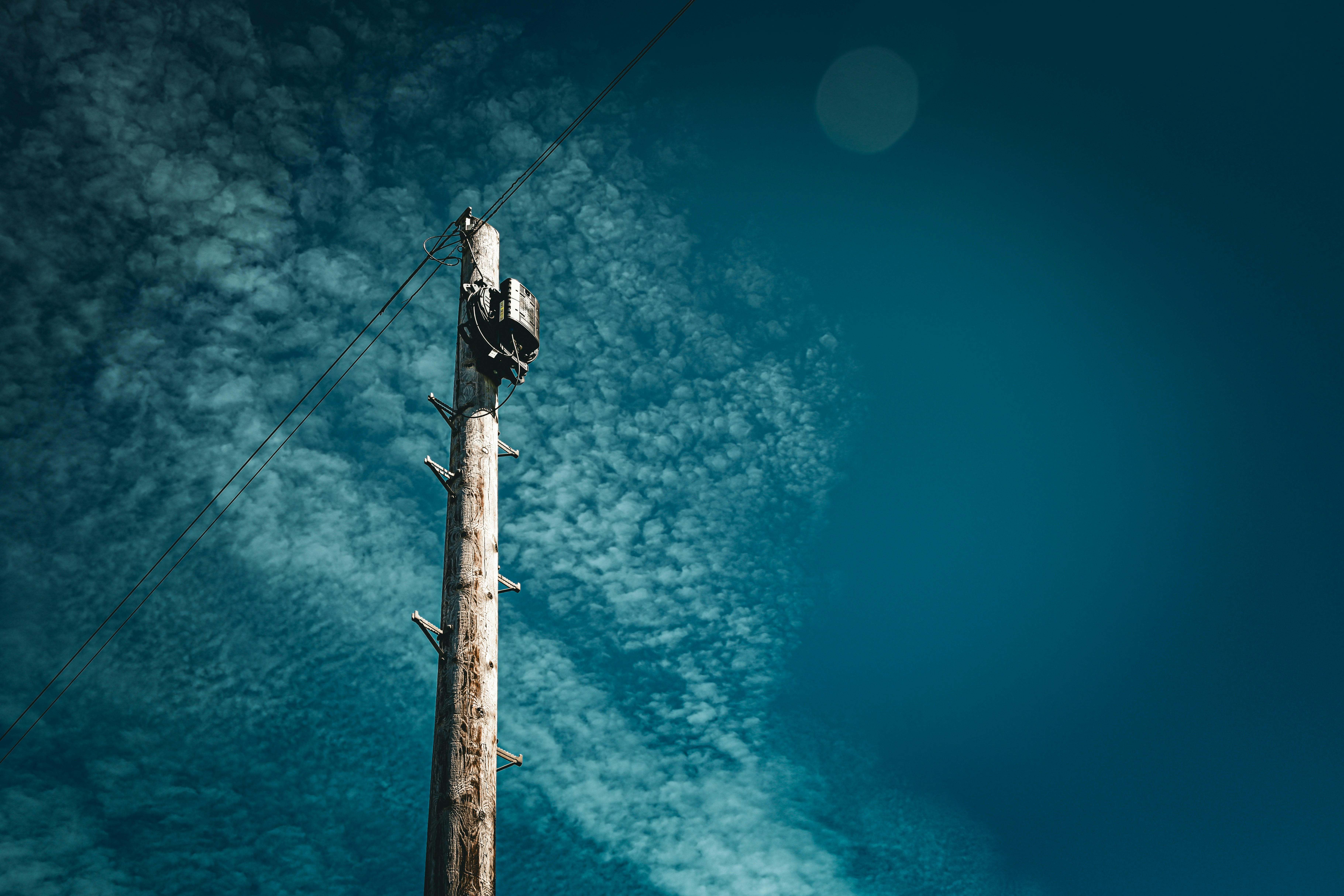 A tall tower with a bird perched on top of it