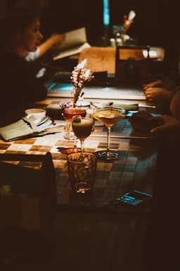 A group of people sitting around a wooden table