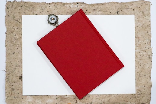 A piece of paper with a red square on it