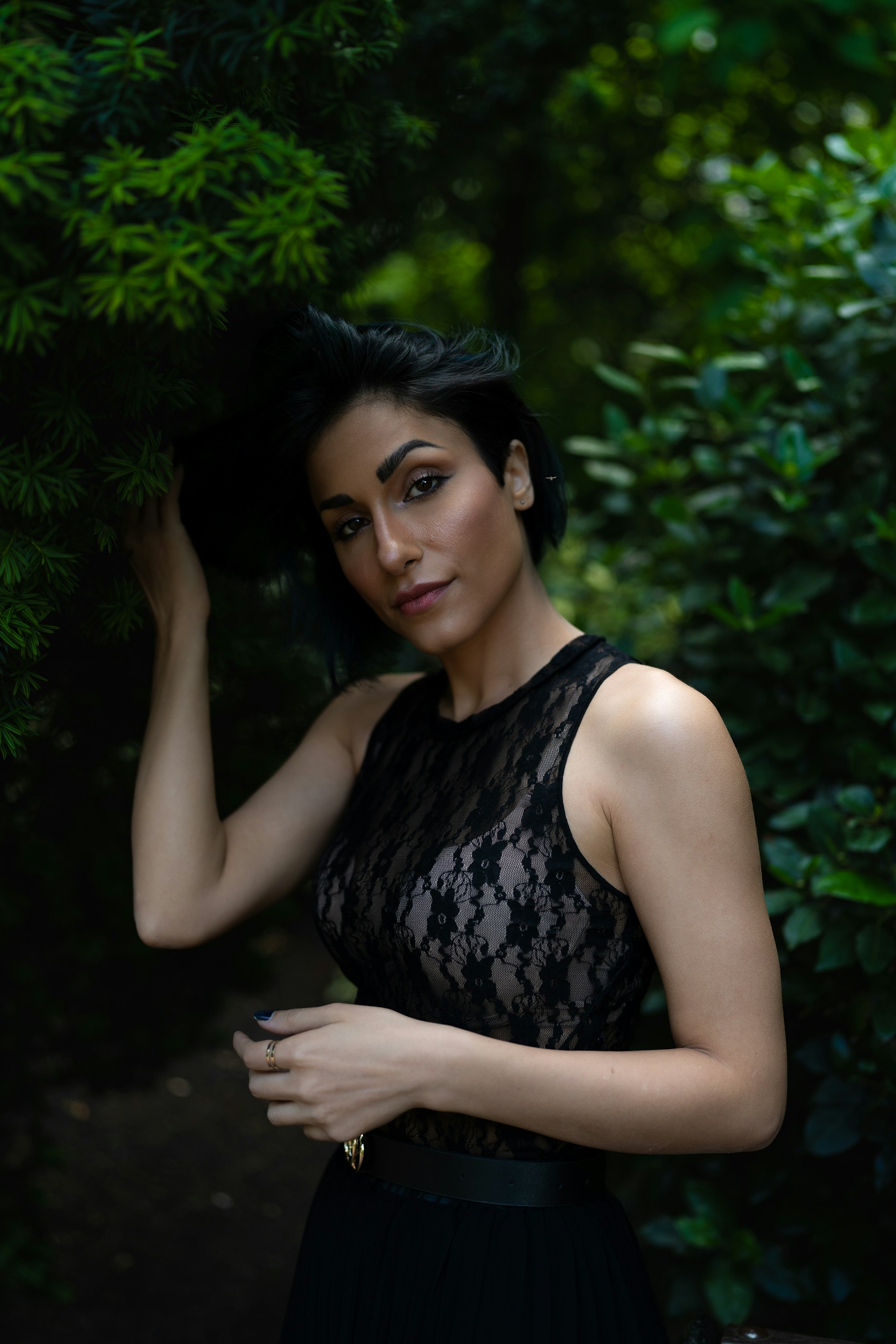 A woman in a black dress posing for a picture
