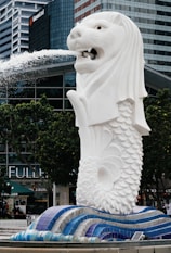 A statue of a lion spewing water out of its mouth