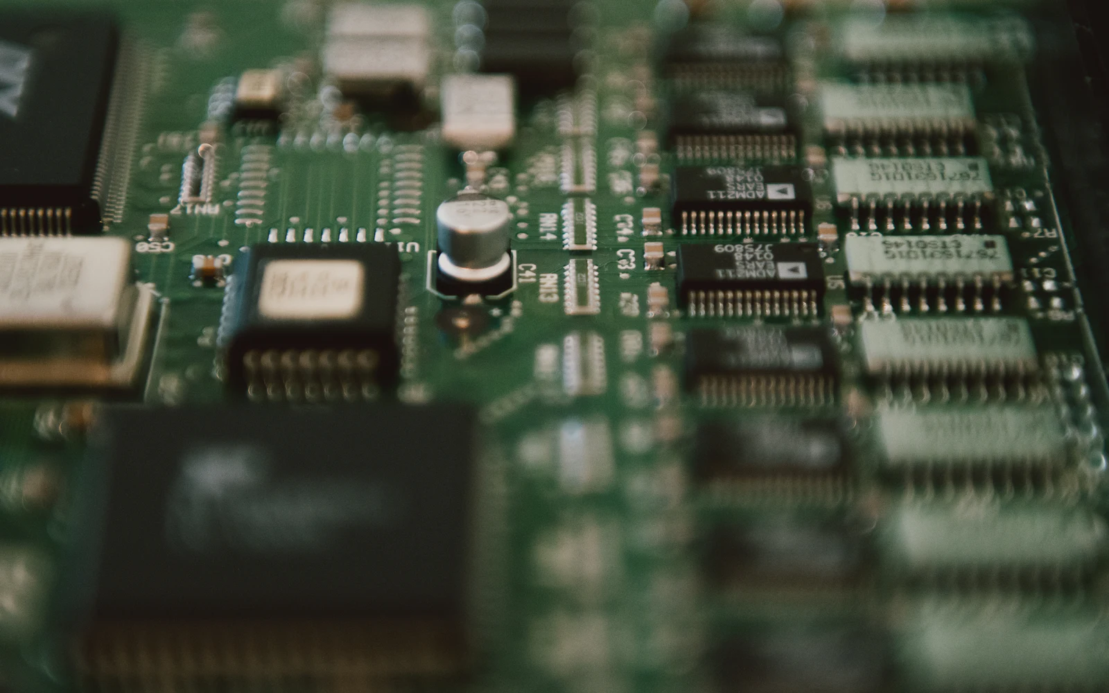 Technician examining electronic hardware for service