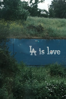 A blue sign that says a is love on it