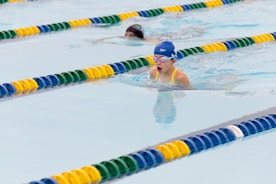 A group of people swimming in a pool
