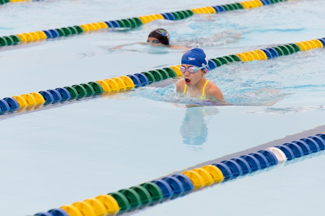 A group of people swimming in a pool