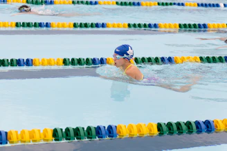 A group of people swimming in a pool