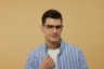 A man wearing glasses and a blue striped shirt