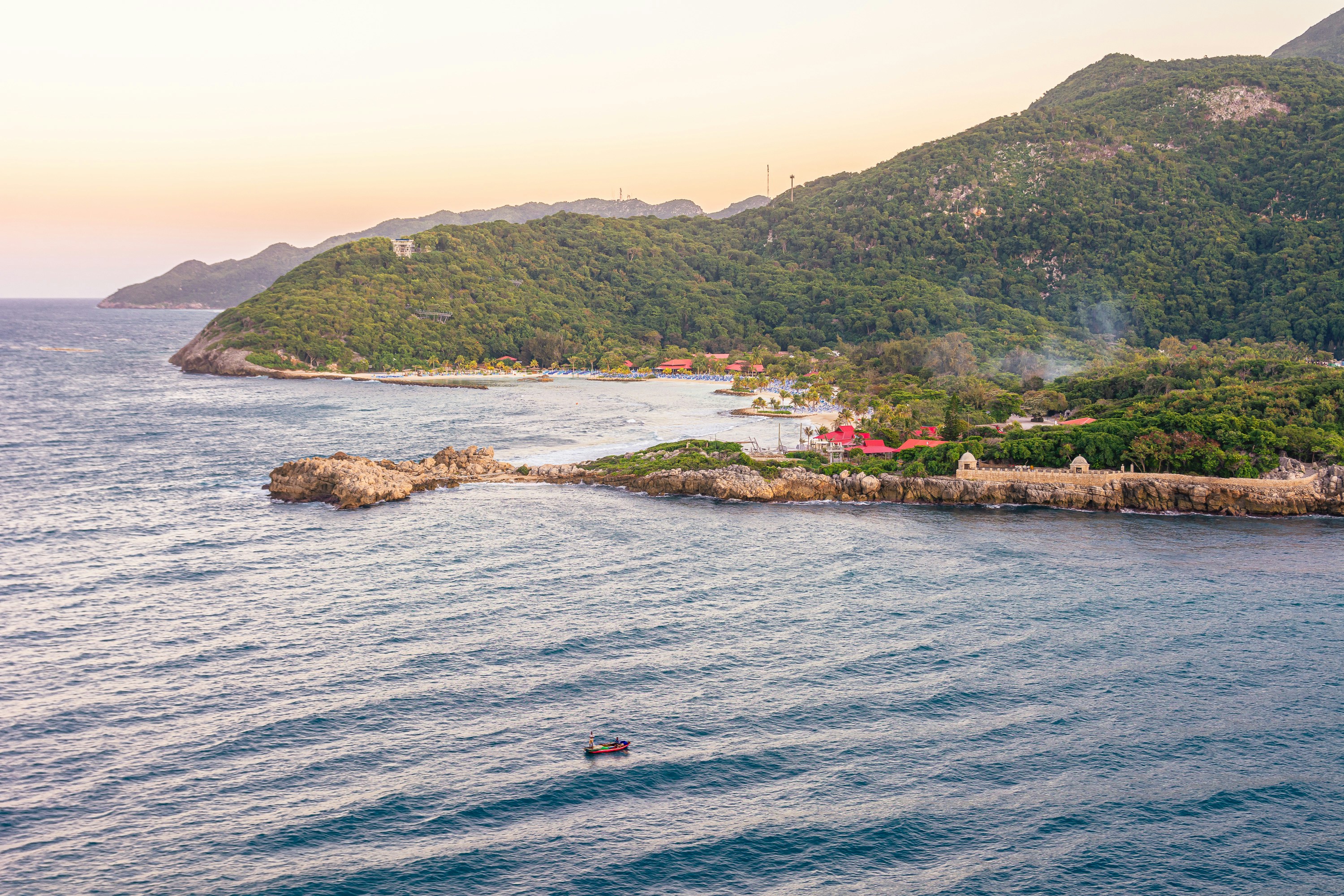 A small island in the middle of a body of water
