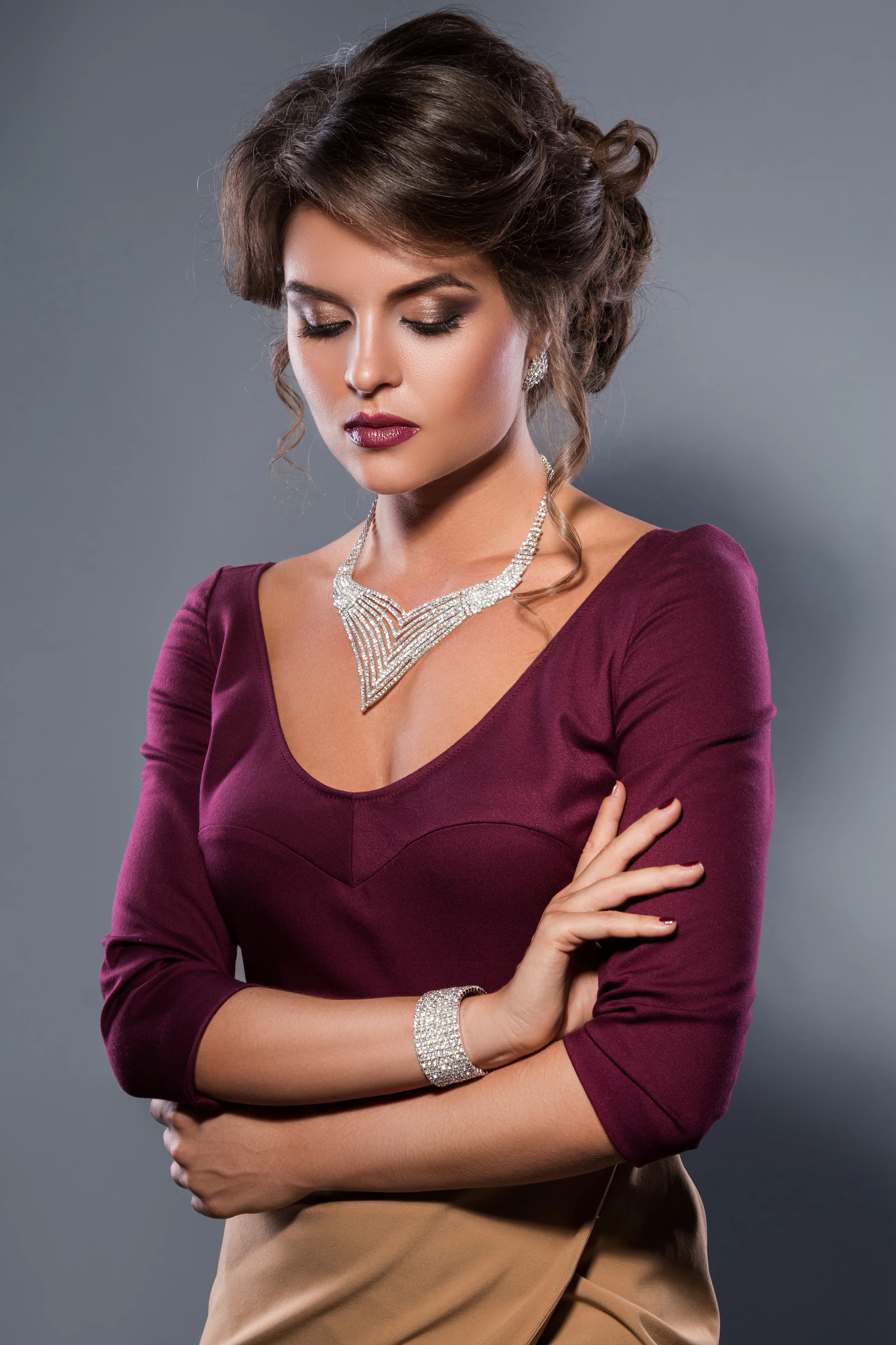 A woman in a dress with her arms crossed