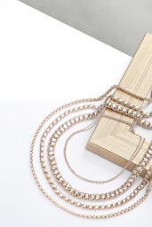 A wooden box with a chain attached to it
