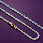 A diamond necklace on a purple surface