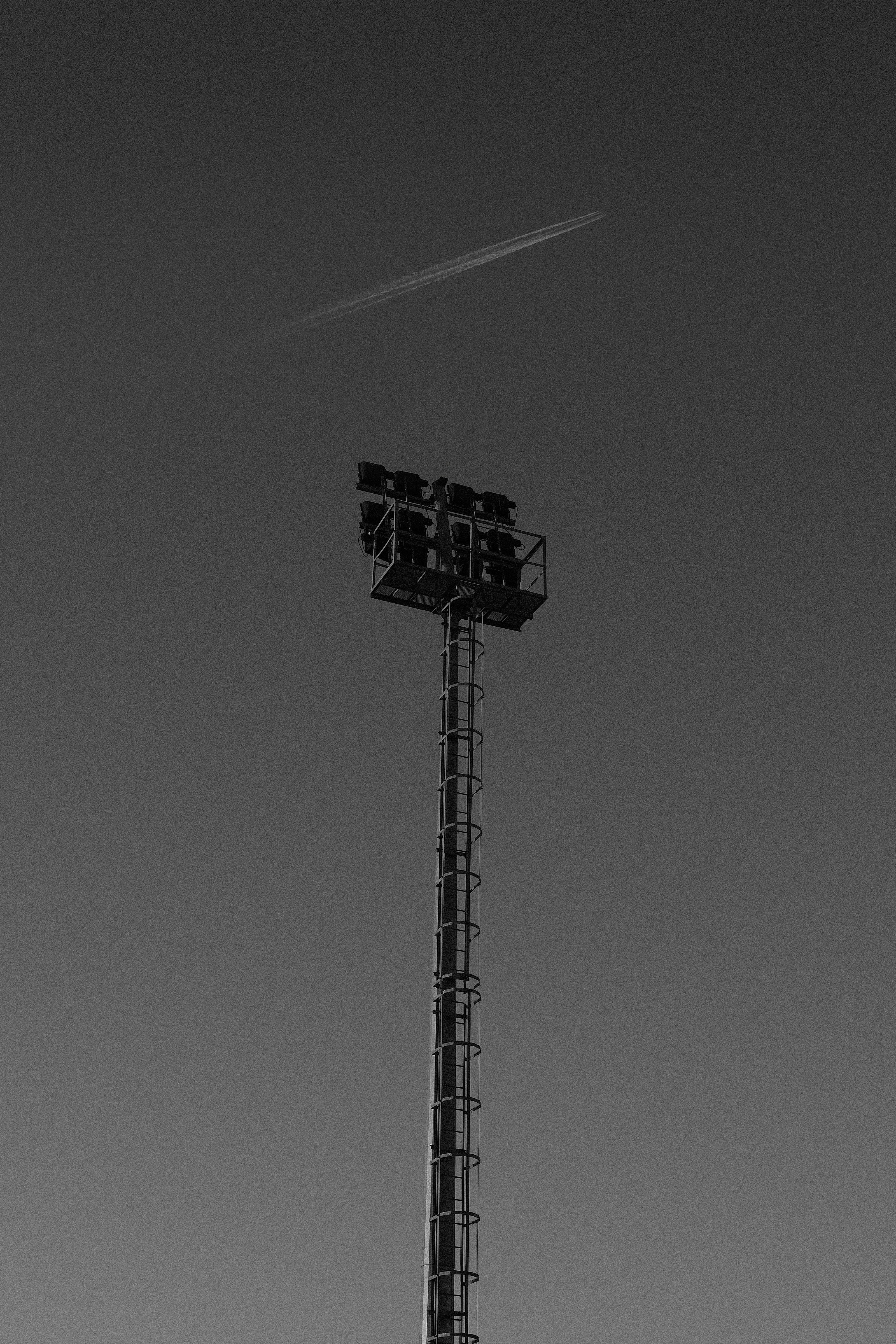 A black and white photo of a tall tower