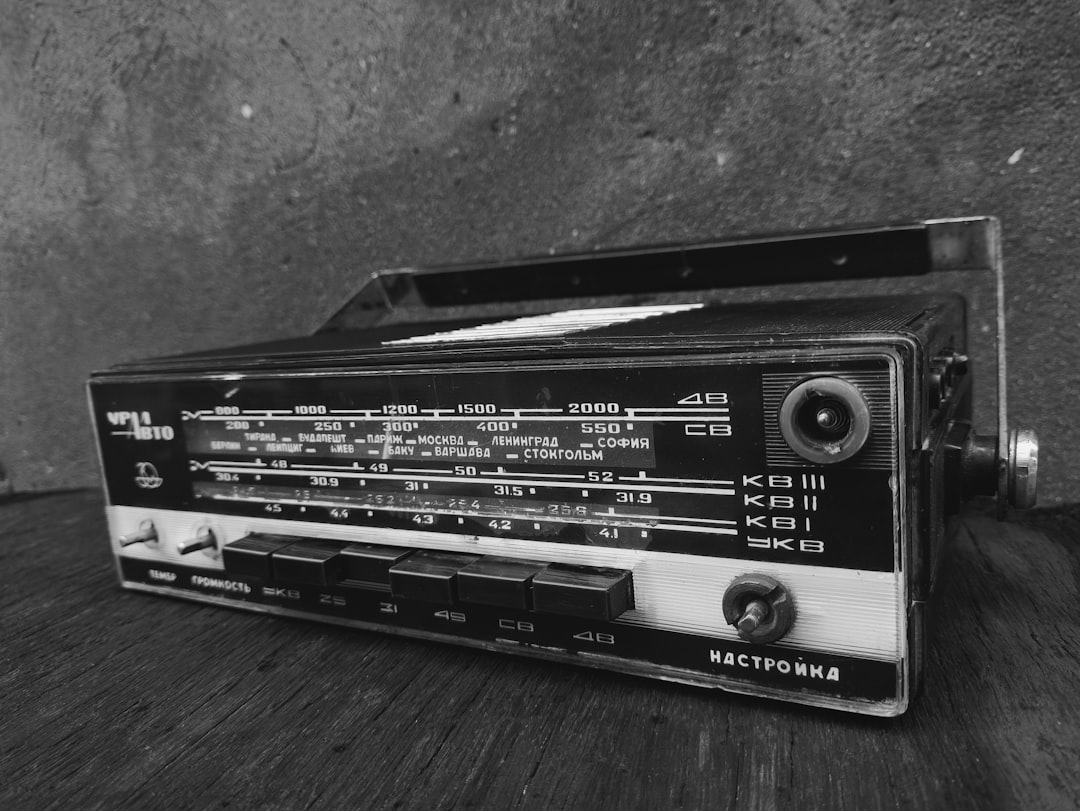 A radio sitting on top of a wooden table,