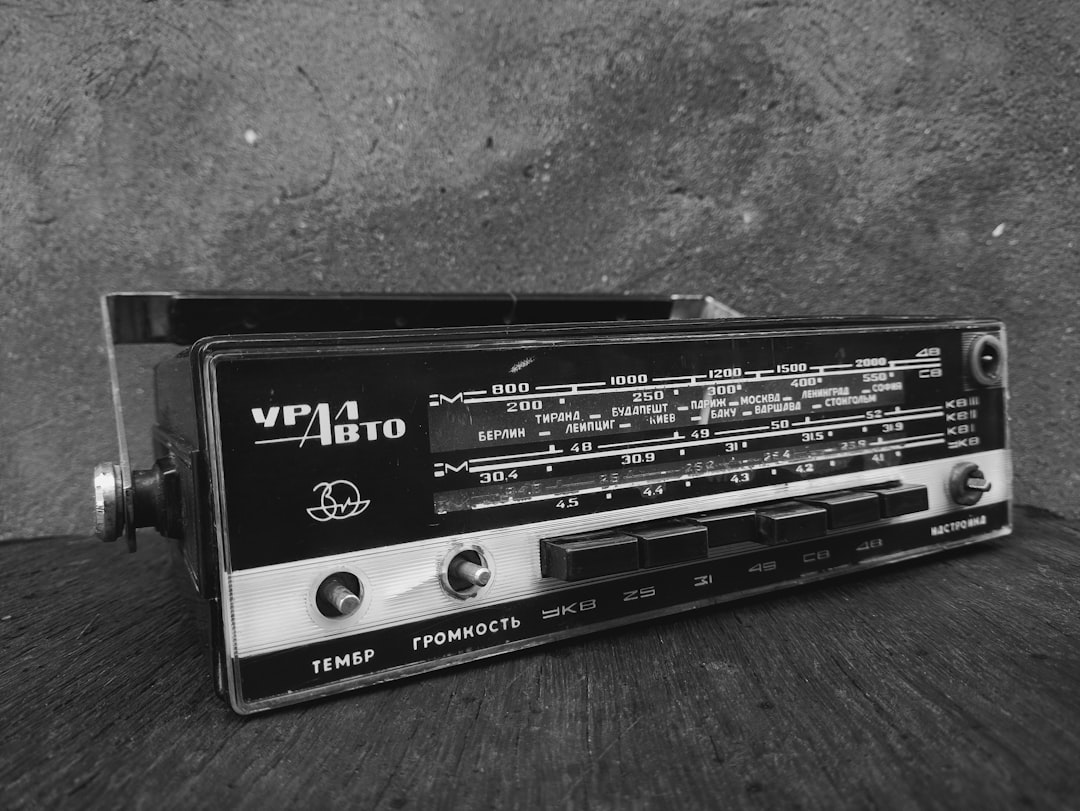 A radio sitting on top of a wooden table,