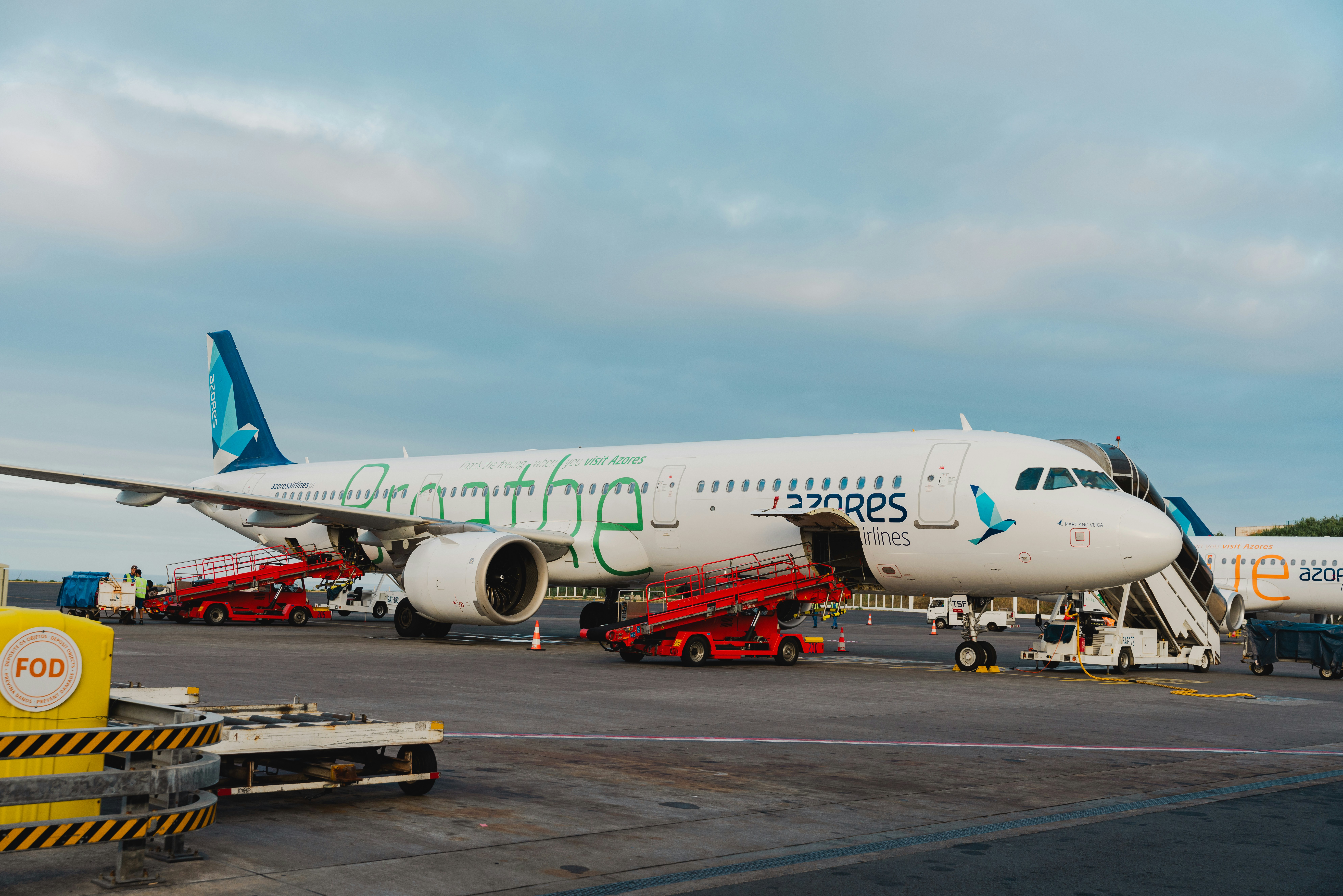 A large jetliner sitting on top of an airport tarmac