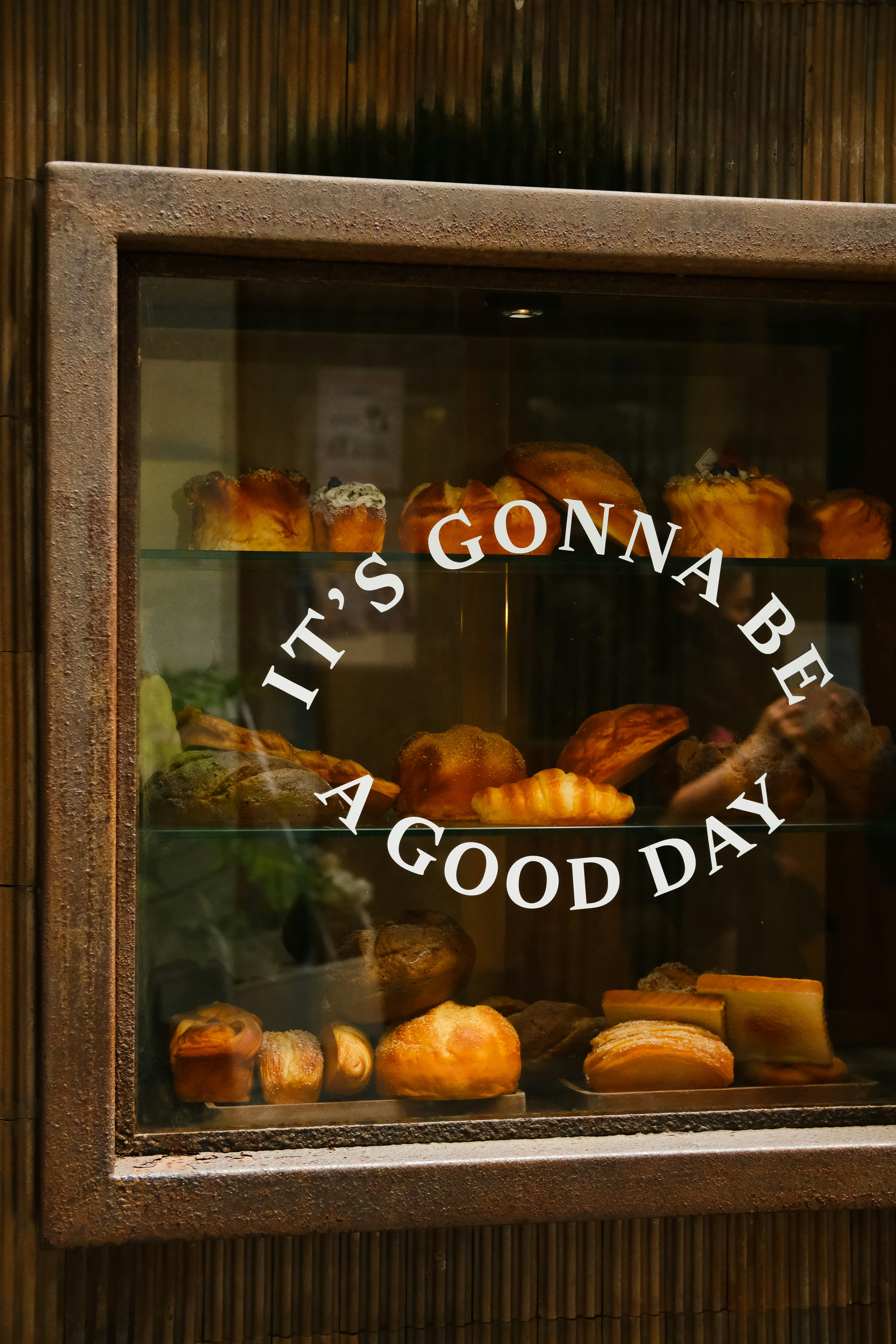 A window with a sign that says it's gonna be a good day