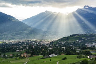 A view of a valley with mountains in the background
