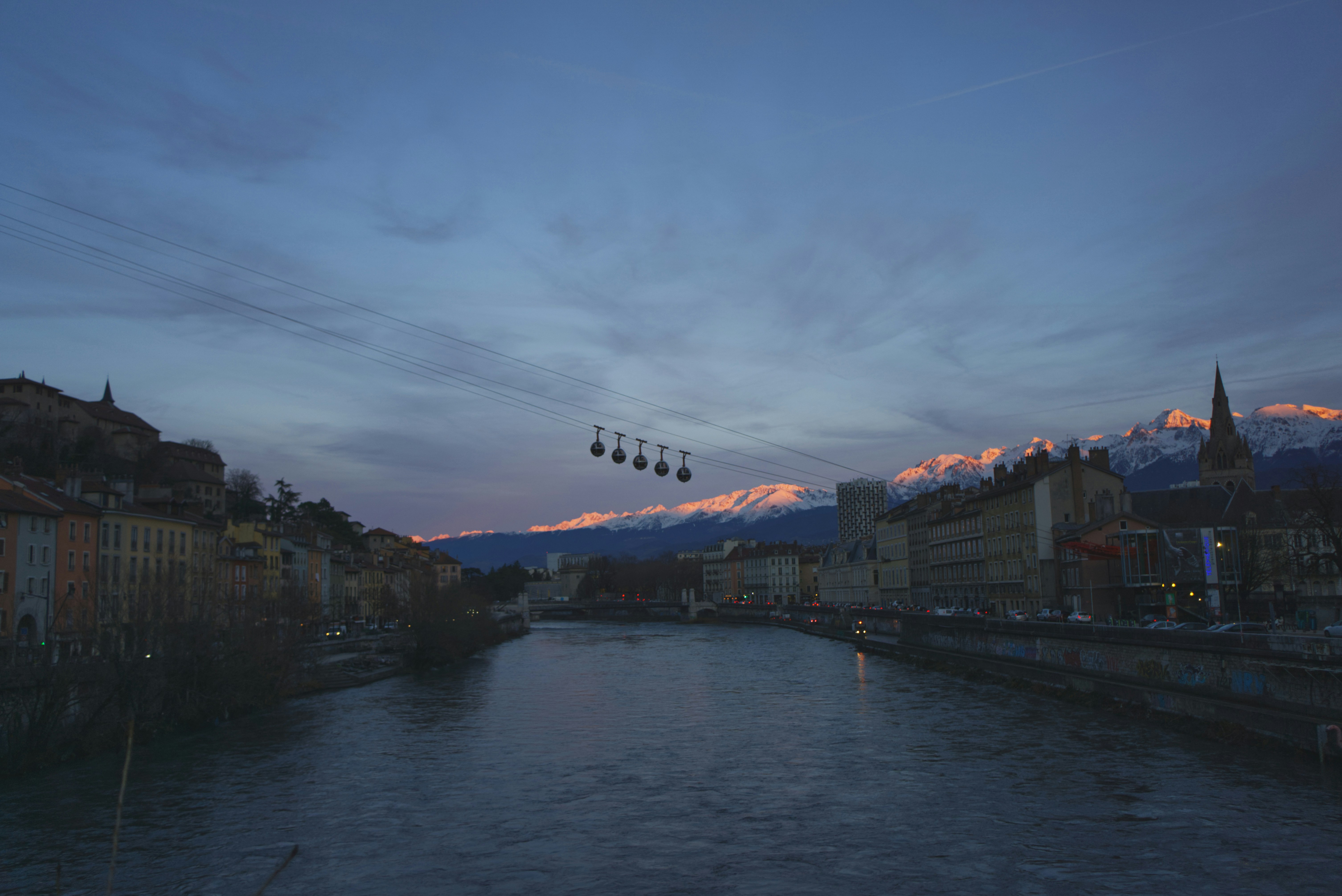 A group of airplanes flying over a body of water