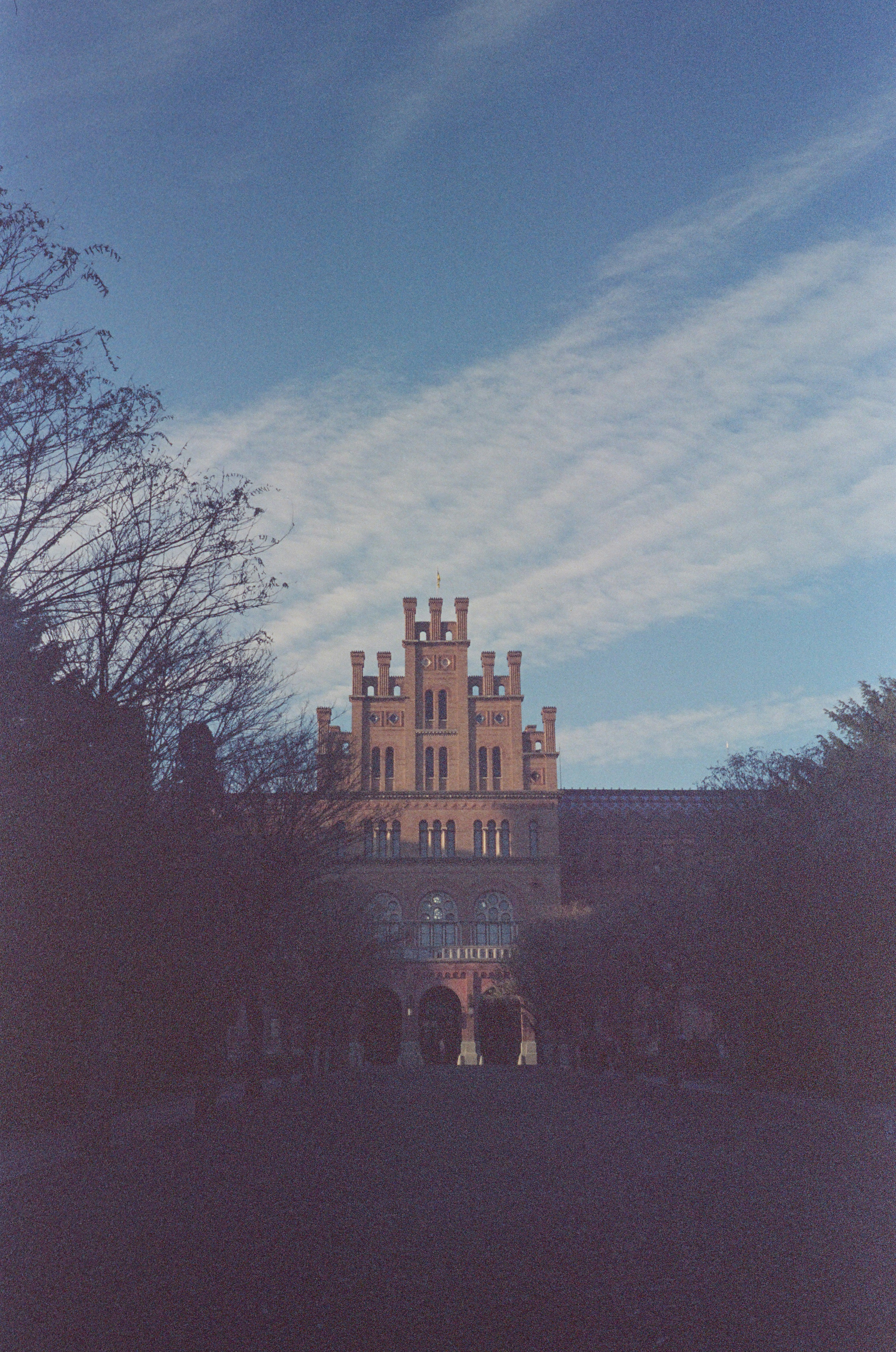 A large building with a clock tower on top of it photo – Free ...