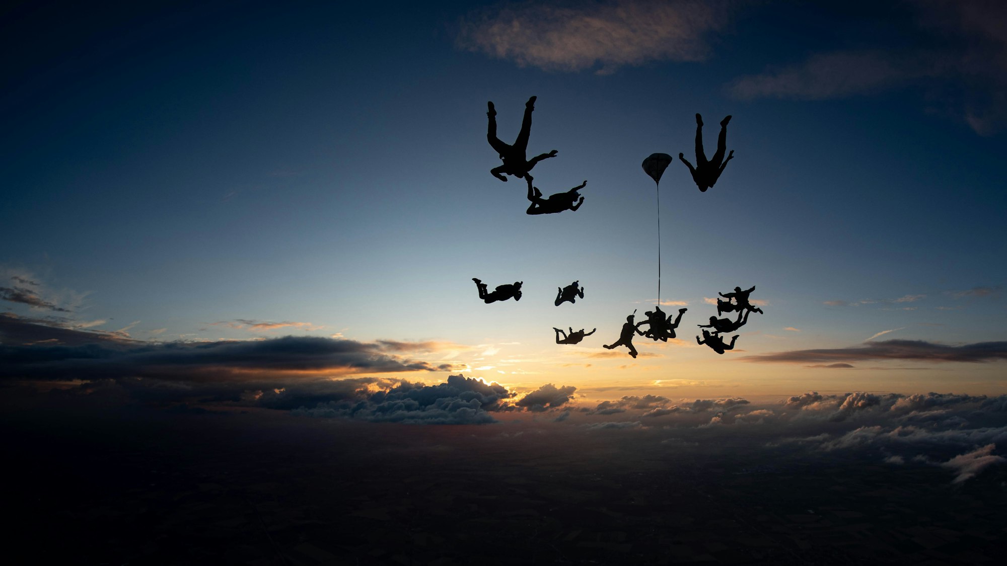 Skydiver in freefall over breathtaking landscape