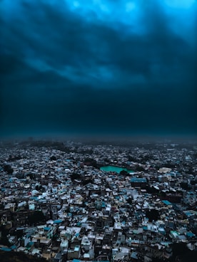 An aerial view of a city under a cloudy sky